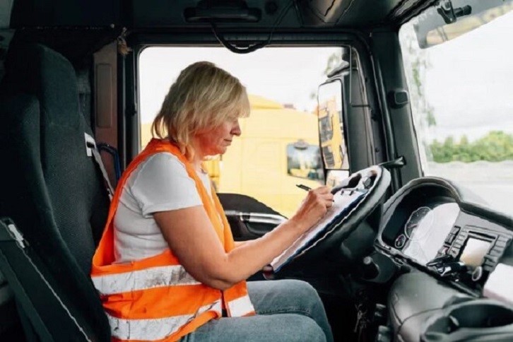 depositphotos 575649348 stock photo mature woman truck driver steering 1